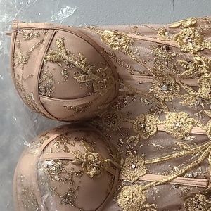 Beautiful strapless rose gold formal gown. Never been worn. Size 2.